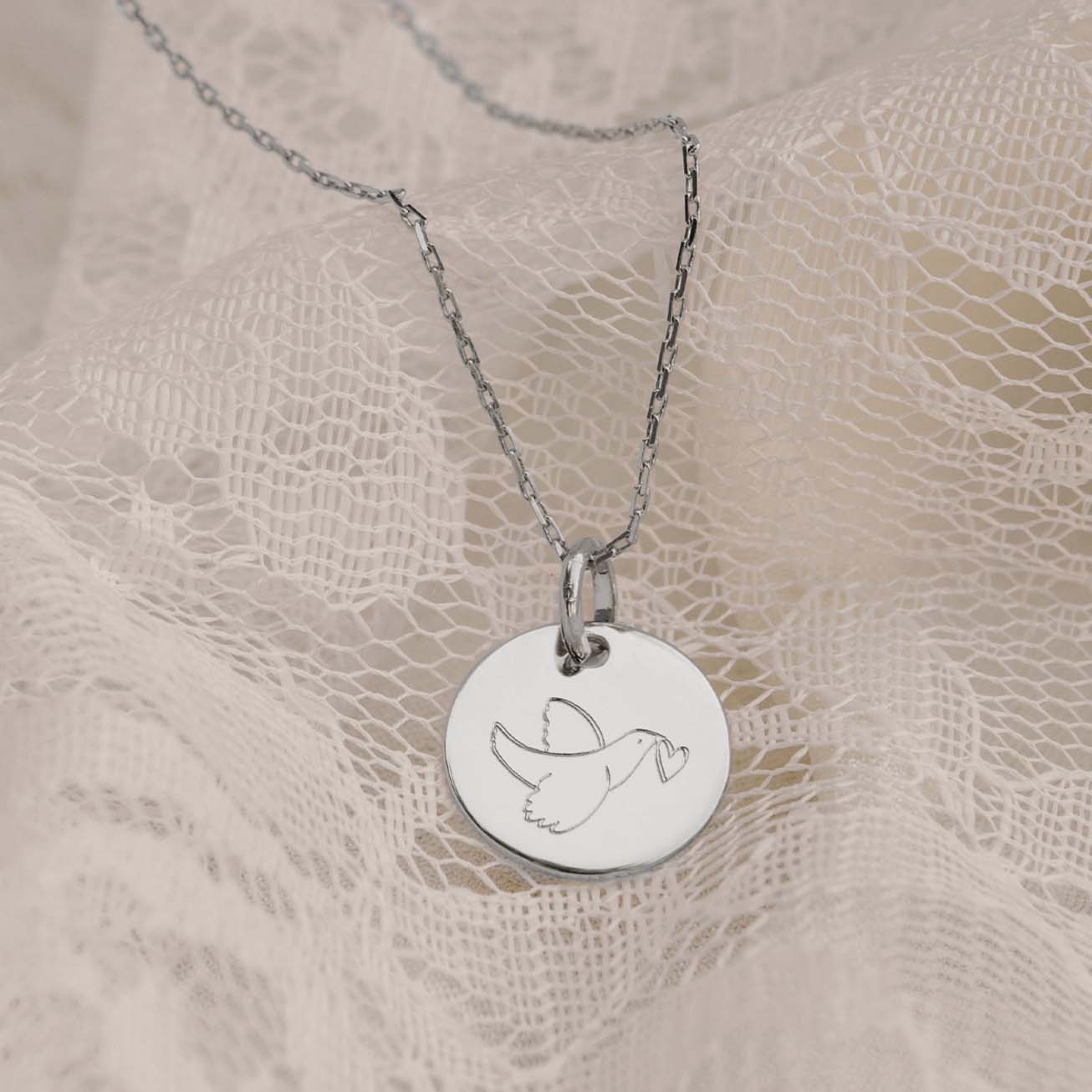 Medalla bautizo plata <i>Paloma corazón</i>