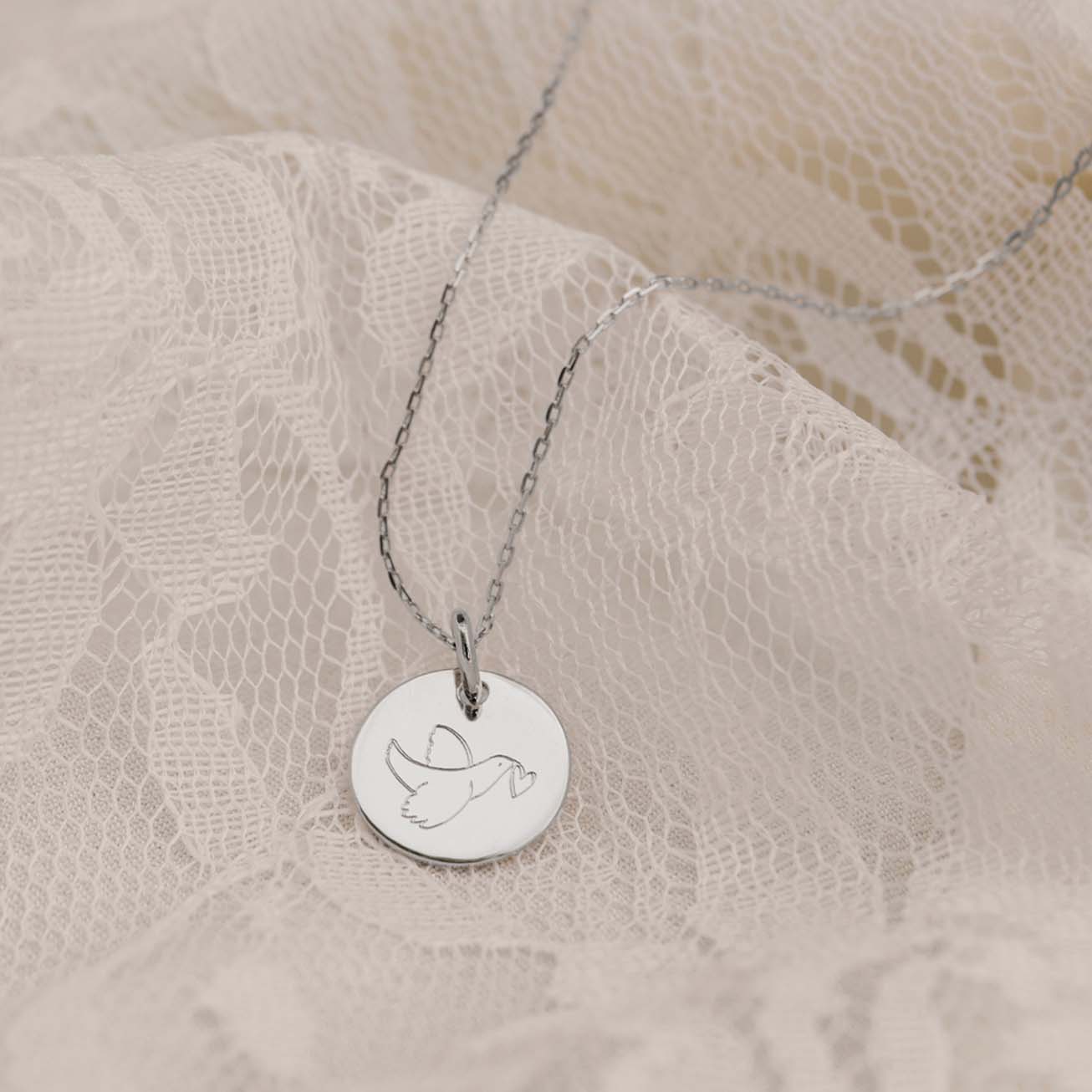 Medalla bautizo plata <i>Paloma corazón</i>