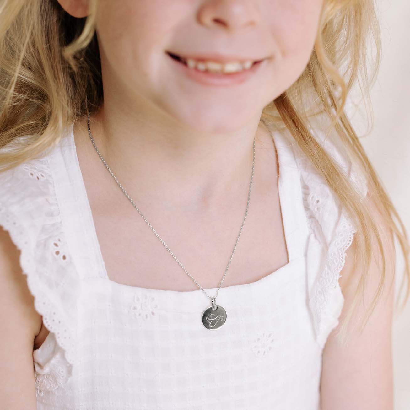Medalla bautizo plata <i>Paloma corazón</i>